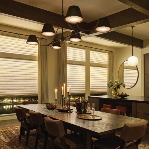 Cozy lighting from the Aura Illuminated Shades is a window treatment trends 2025